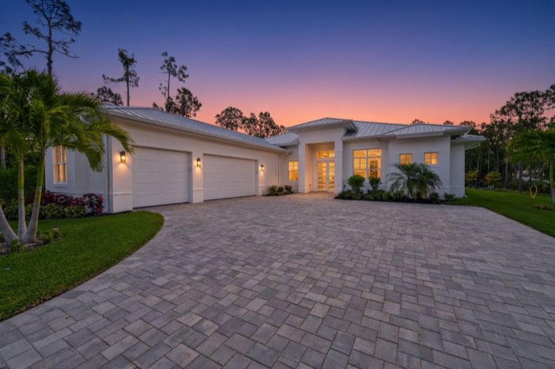 Twilight photo of a white Florida home